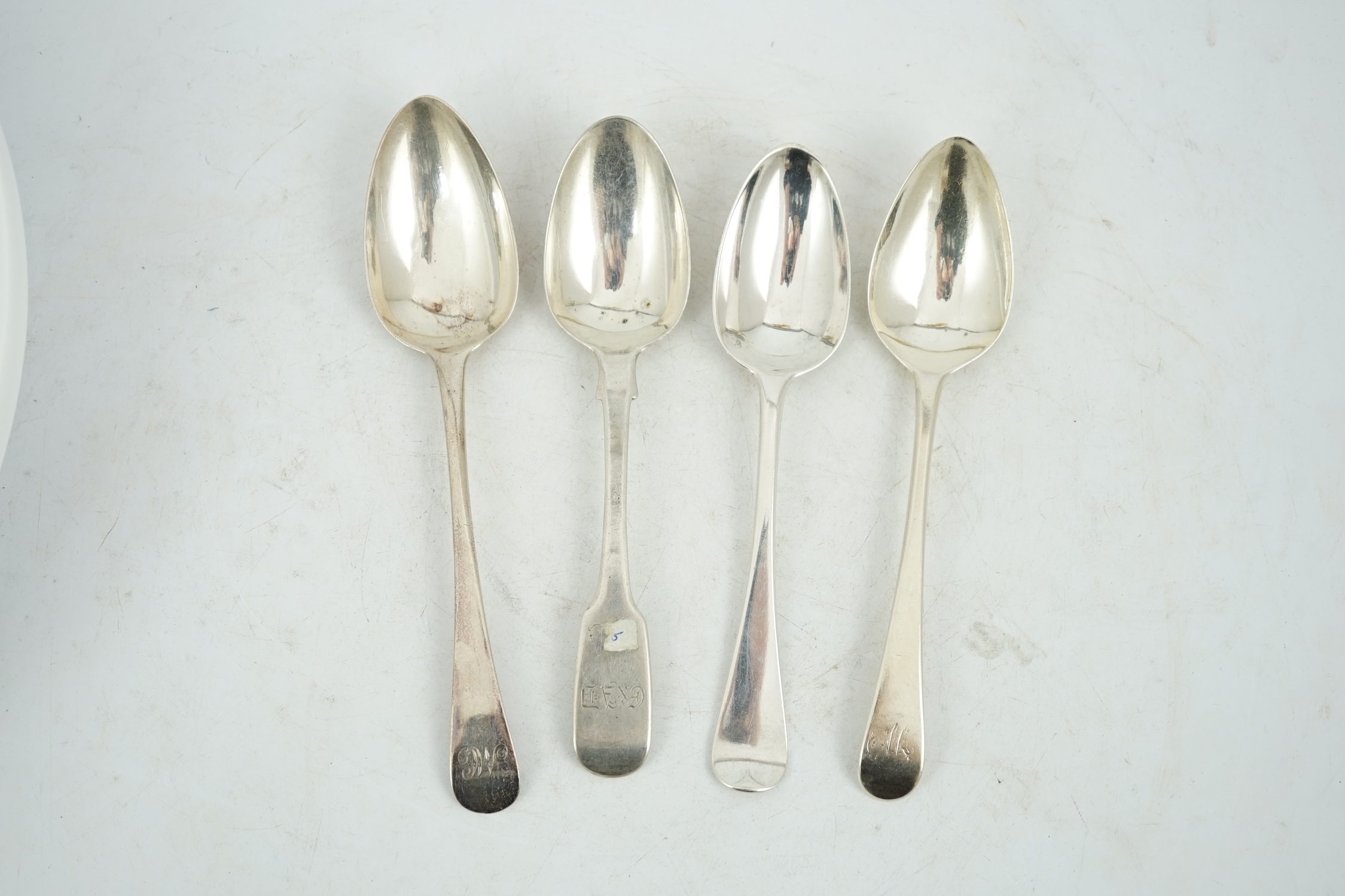 A harlequin collection of twenty mainly 19th century silver fiddle pattern dessert spoons, various dates and makers, together with fourteen similar Old English pattern dessert spoons, various dates and makers